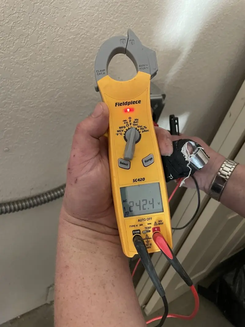 Voltage testing with clamp meter during Ceiling Fan Installation in Wauchula